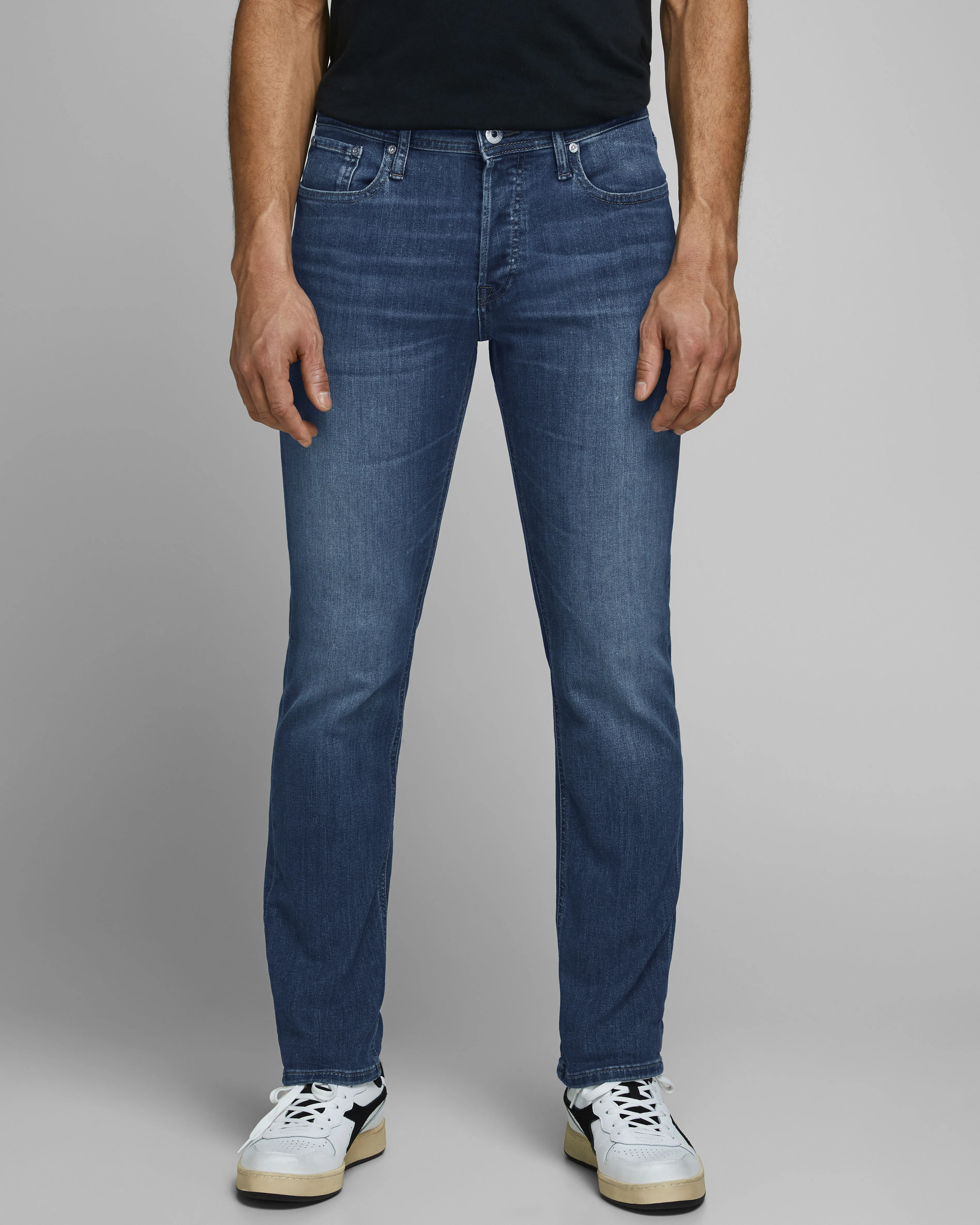 Jeans Glenn slim fit in cotone stretch lavaggio medio stone washed con baffature
